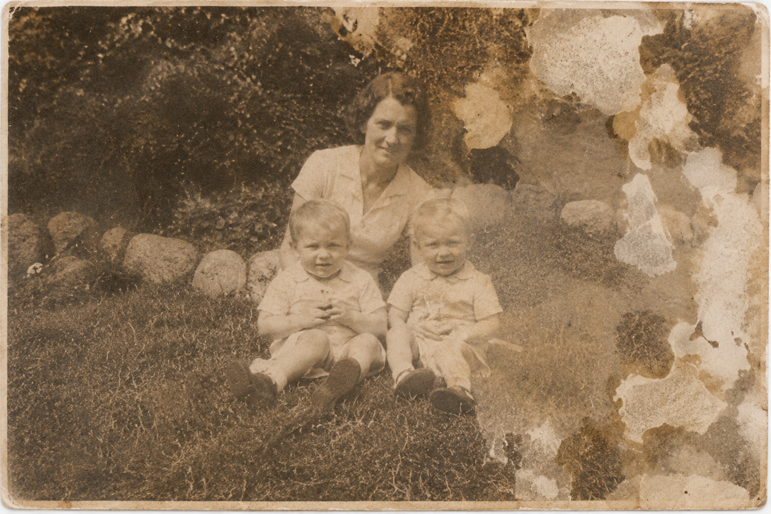 Water-damaged family photograph before restoration