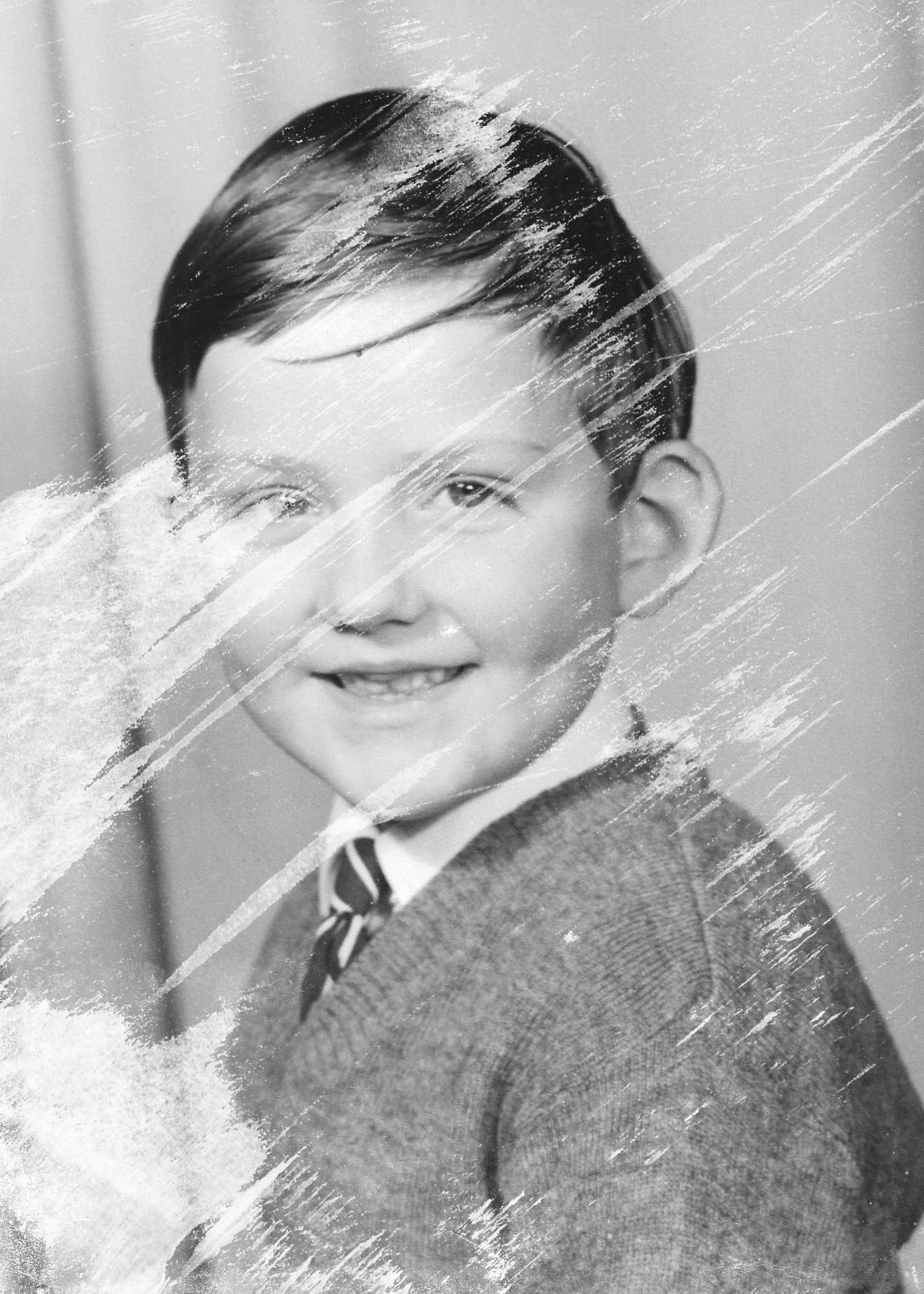 Original damaged schoolboy portrait before photo restoration