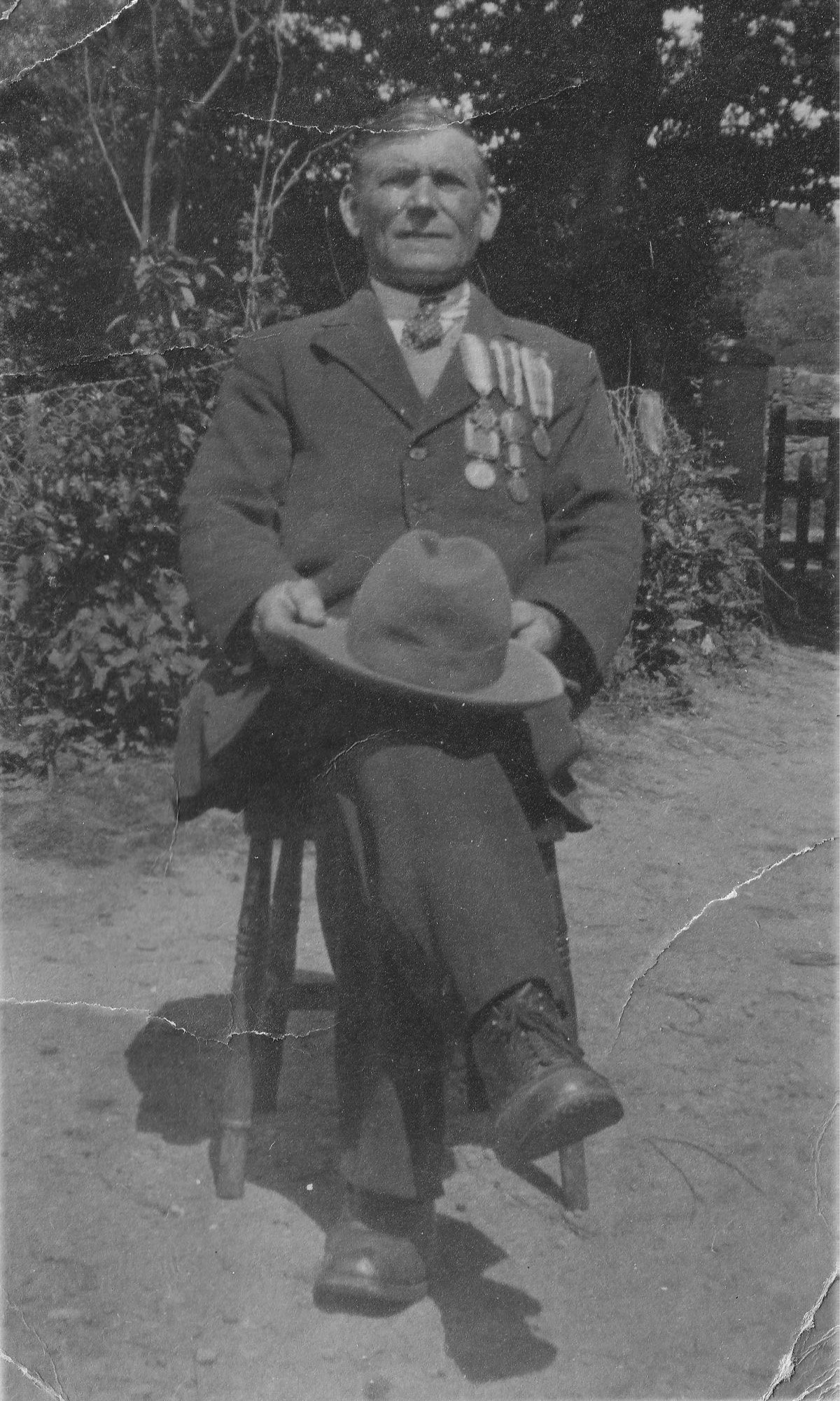 Damaged photograph before restoration